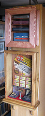 Octagonal cabinet with a circular door 
displaying fiber phonograph needles